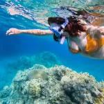 Snorkeling stop at vibrant coral reefs during Hurghada sea scope trip.