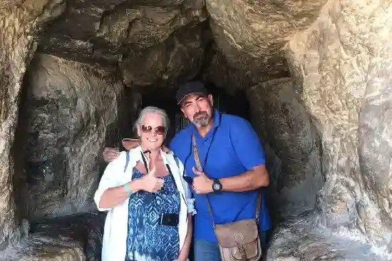 Professional private tour guide explaining history to a client in Cairo.