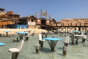 Wooden swings in the shallow water of Orange Bay Hurghada.