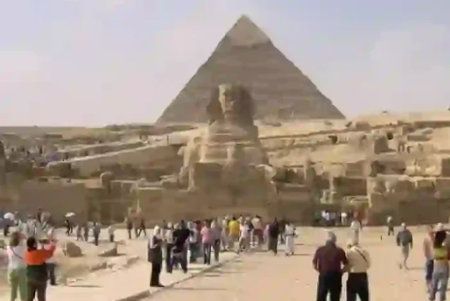 Camel riding at the Giza Pyramids during Cairo minibus trip.