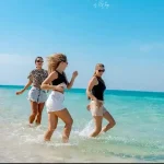 Happy family enjoying the sunny Hula Hula Island excursion.