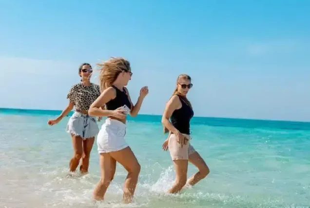 Happy family enjoying the sunny Hula Hula Island excursion.
